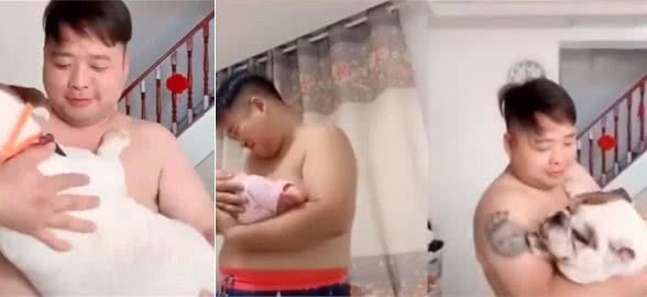 新手爸爸为练习抱娃，狂抱自家45斤斗牛犬，现在已得心应手